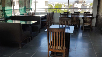 Roof Rasoi Restaurant & Café - Hotel Samridhi inside