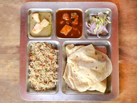 Veg Thali (Veg Rice, Roti, Butter Paneer, Chilli Paneer And Salad.