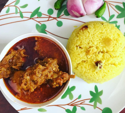 Basanti Pulao And Chicken Kosha