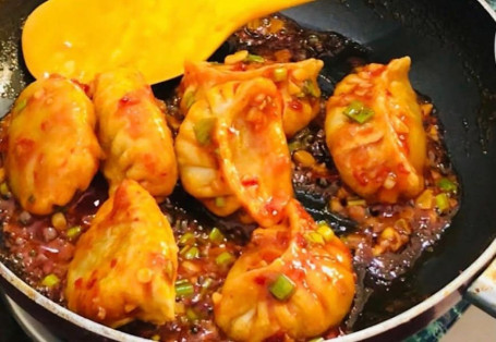 Chicken Pan Fried Momo In Schezwan Sauce