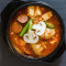 82. Kimchi Stew With Assorted Sausages, Pork, Tofu Dumplings