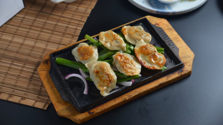 106. Sizzling Fried Pork Dumplings Hé Zhī Tiě Bǎn Jiān Jiǎo Zi