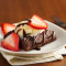 Brownie With Vanilla And Strawberry Toppings