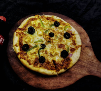 7 Makhni Paneer Pizza 1 Coke (250 Ml)