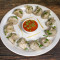 Steam Veg Momos 12 Pcs Served With Red Spicy Chutney Mevnies