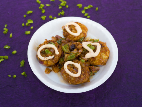 Veg Pan Tossed Masala Momos