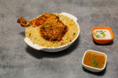 Chicken Dum Biryani Served With Raita And Salan (Serves 1)