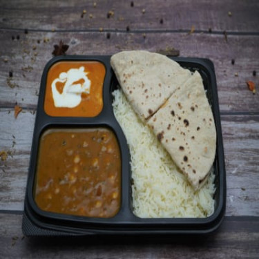 Chole, Kadhai Paneer, Tawa Roti (4), Rice, Salad Raita Thali