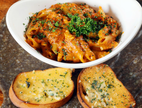 Penne Pasta In Pink Sauce With Garlic Bread