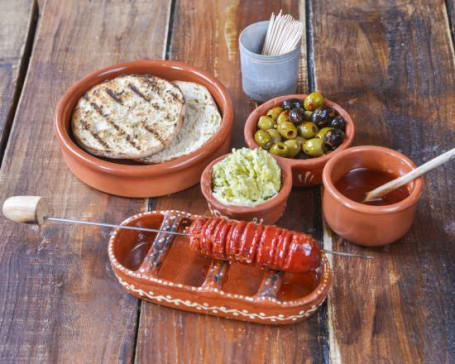 Chargrilled Chourico, Marinated Olives And Traditional Portuguese Bread With Garlic Butter