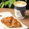 A croissant or Pain au Chocolat with any hot beverage