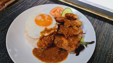 Chicken Wings And Fried Egg With Curry Sauce On Rice