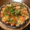 Smoked Salmon And Rockets Pizza In Squid Ink Sauce