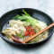 Ramen With Chicken Gyoza And Pak Choi In Aromatic Soy Broth