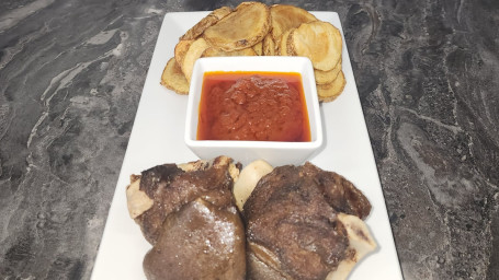 Pelloma's Fusion: Potato Chips, Bed Of Red Stew, 2 Goat Meat