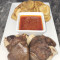 Pelloma's Fusion: Potato Chips, Bed Of Red Stew, 2 Goat Meat