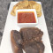 Pelloma's Fusion: Potato Chips, Bed Of Red Stew, 3 Beef Meat