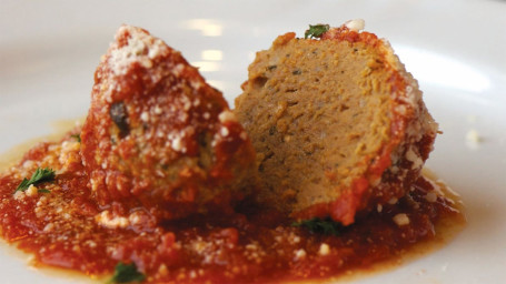 Five (5) Meatballs Baked W/ Mozzarella Marinara. Includes Garlic Bread