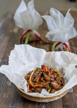 328 Paper Wrapped Tender Beef Cooked With Sliced Onions And Chilli Sauce