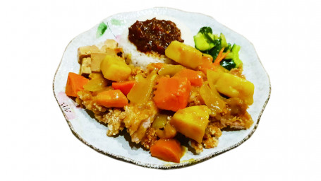 Crispy Chicken Fillet With Rice In Curry Sauce