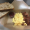Scrambled Eggs On Toasted Sourdough With Bacon And Chilli Relish