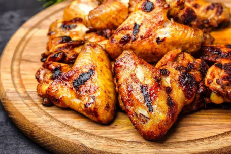 6 Marinated Grilled Wings.