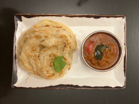 Rotti Canai Served With Chicken Curry