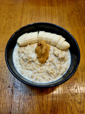 Honey Banana Porridge Served With Coconut Flakes