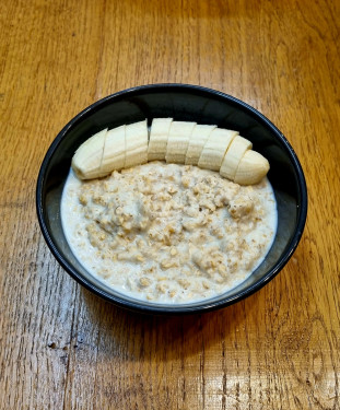 Peanut Butter Banana Porridge Served With Chia Seeds And Honey