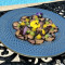 Mosaico di branzino, tonno e salmone con riduzione di sedano, alga Wakame e gelly al mango