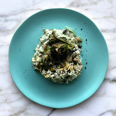 Kale and yoghurt dip with candied orange and pumpkin seeds