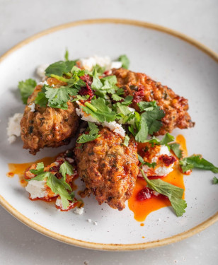 Courgette Fritters, Labneh, Feta, Rose Harissa, Pea Shoots