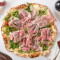 Pizza With Fresh Rocket Leaves And Thin Sliced Parma Ham