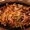 Spicy pork bulgogi with squid on the hot plate